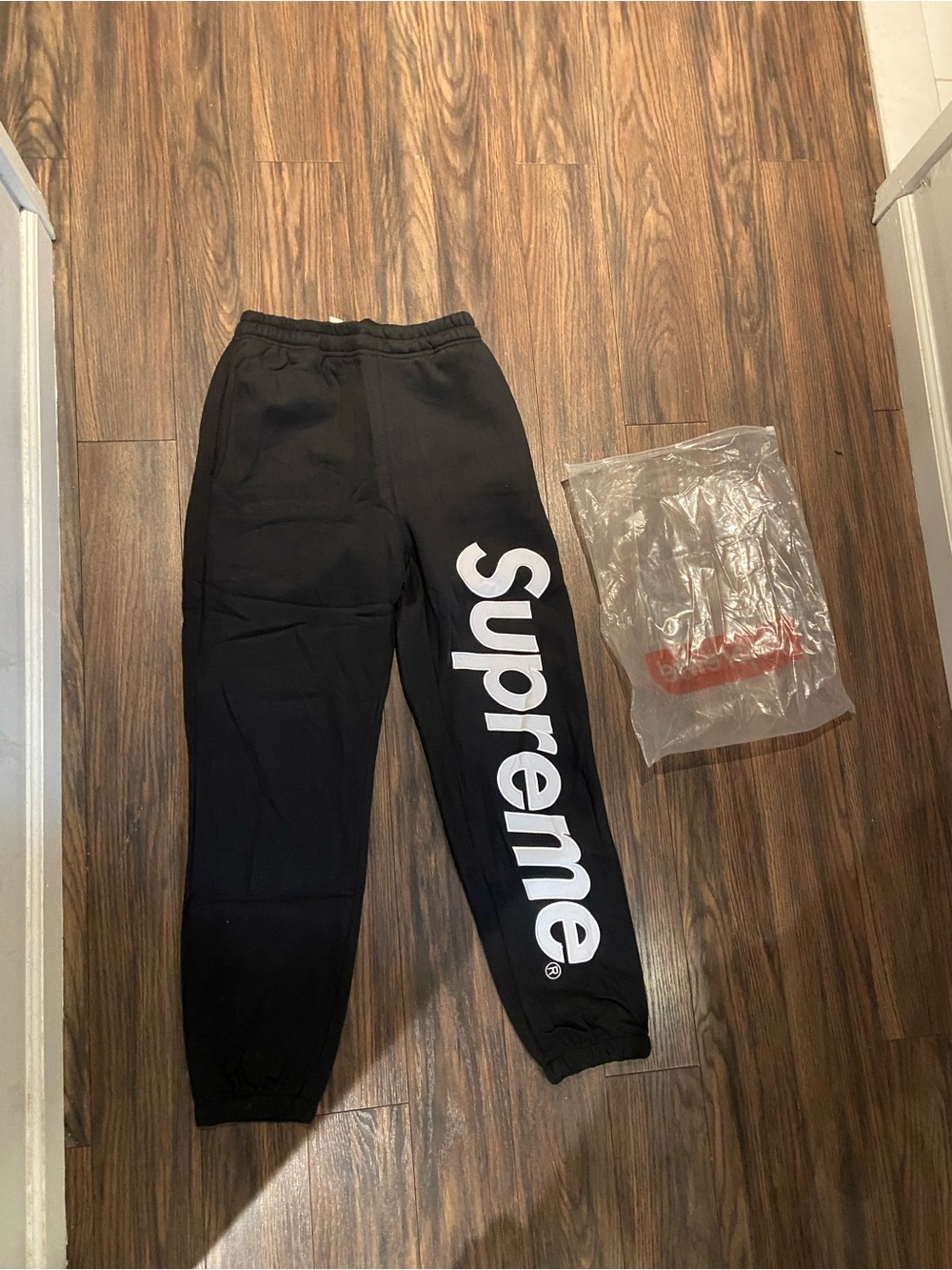 Supreme Black Sweatpants with Large White Side Logo